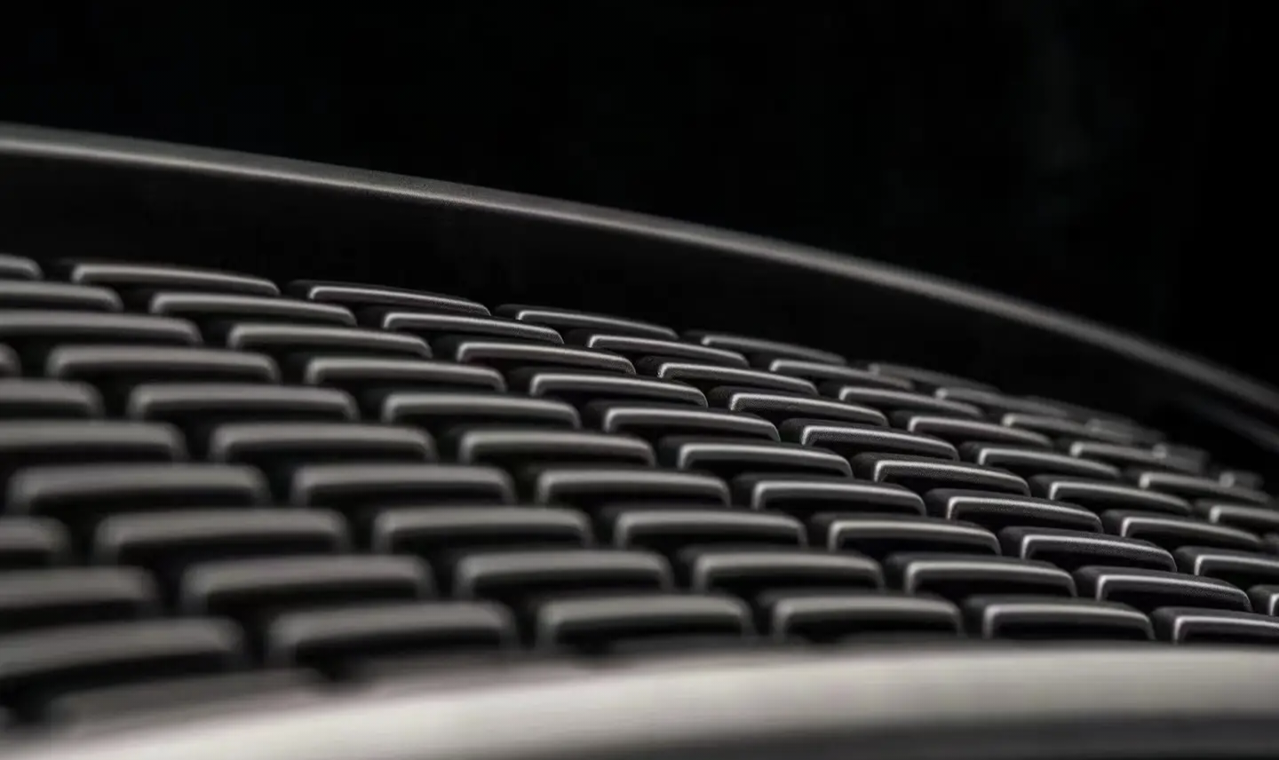 A detailed button- to-up view of the top fire tank 300 front grille "Darkness," showcasing intricate design and craftsmanship.a