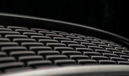 A detailed button- to-up view of the top fire tank 300 front grille "Darkness," showcasing intricate design and craftsmanship.a