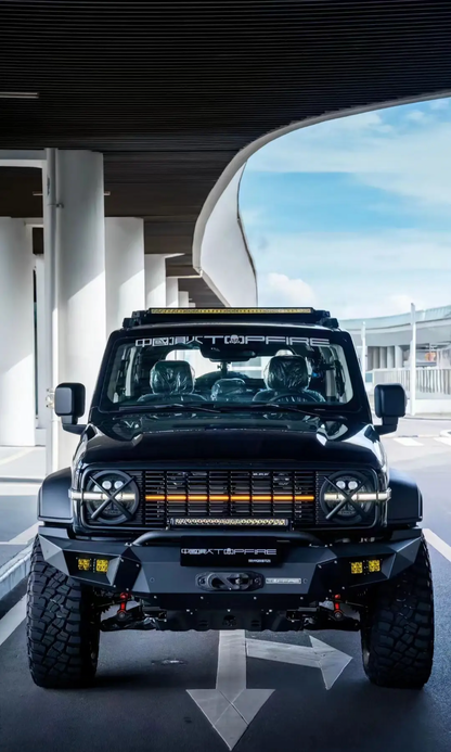 A black Tank 300 with a top fire front grille "Darkness" and yellow daytime running lights illuminated.